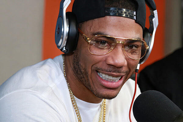 An image of Nelly wearing headphones.