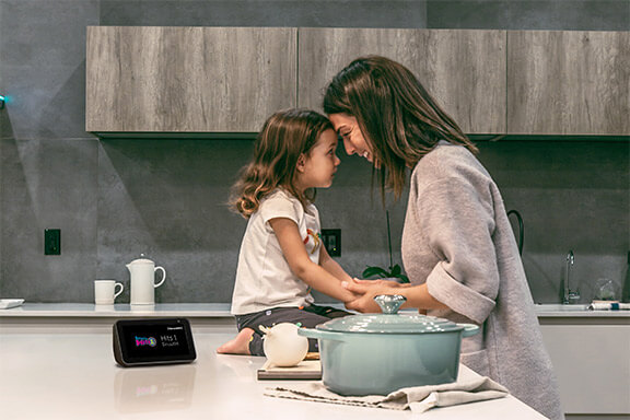 Mother and daughter listing to SiriusXM Hits 1 in the kitchen.