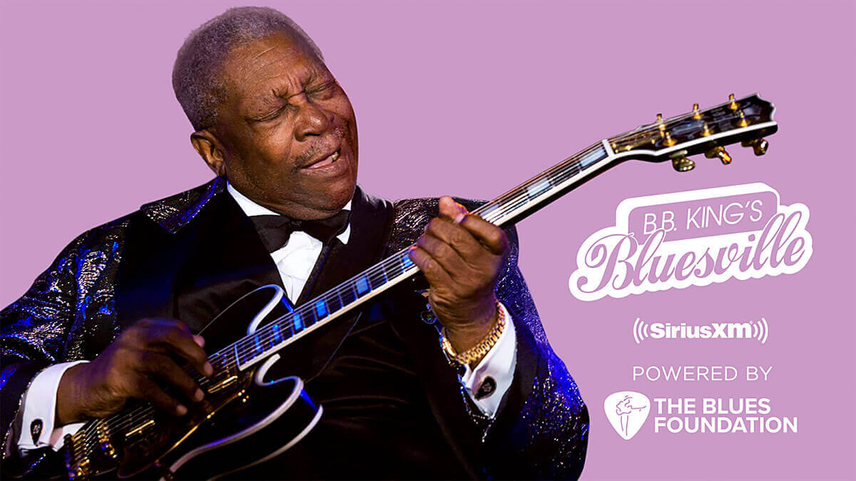 A photograph of B.B King playing his guitar, Lucille.