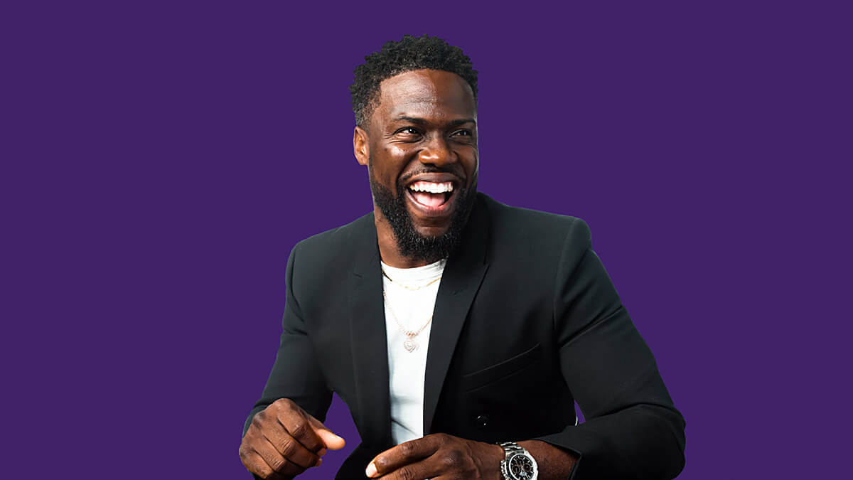 An image of Kevin Hart laughing