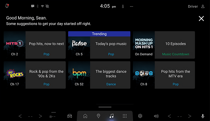 A SiriusXM infotainment screen for Mazda displays music suggestions such as pop hits, todays pop music, rock from the 90s and 2000s, dance tracks, and music countdowns, with a greeting for the user at the top.