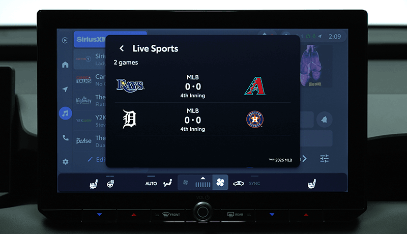 A SiriusXM infotainment screen for Toyota with 360L shows Live Sports Play-by-Play updates with two MLB games: Rays vs. Diamondbacks and Tigers vs. Astros.