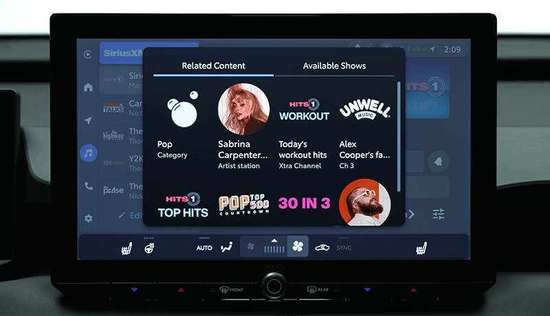 A SiriusXM infotainment screen for Toyota with 360L displaying a pop-up menu with Related Content, including artist Sabrina Carpenter, today’s workout hits, Alex Coopers podcast, and various music channels.