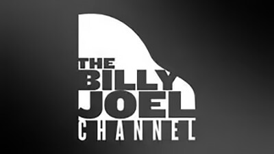 Logo featuring the words The Billy Joel Channel and What’s New in bold white text, arranged inside the silhouette of a grand piano on a black and gray background.