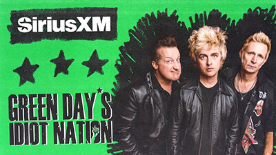 Three members of Green Day stand in front of a green background with black stars. Text reads SiriusXM, What’s New, and Green Day’s Idiot Nation. All three wear black jackets and look toward the camera.