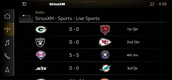 A SiriusXM infotainment screen for Audi with a 360L radio displays live sports scores: Packers vs. Bears, Raiders vs. Chiefs, Phillies vs. Astros, and Jets vs. Dolphins