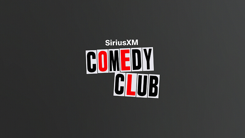 A dark gray background with the text SiriusXM Comedy Club in bold letters. The words Comedy Club are styled with alternating black and red letters on white rectangles, resembling cut-out magazine letters. Listen to SiriusXM Comedy Club on SiriusXM.