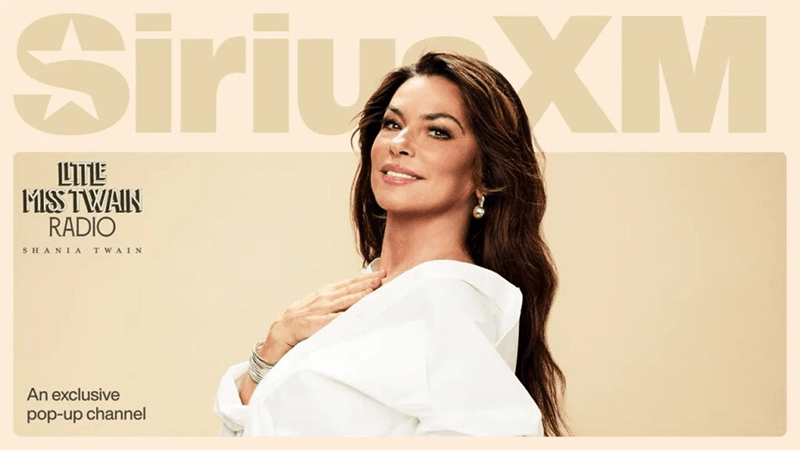 Shania Twain is pictured with long brown hair in a white top smiles with her hand on her chest. The background features SiriusXM branding and text promoting Little Miss Twain Radio available for a limited time on Channel 510.