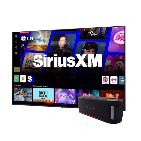 A smart TV displays the SiriusXM app interface with music channels. In front of the TV is a black portable speaker, next to a Google Nest Mini, ready to fill the room with rich sound.